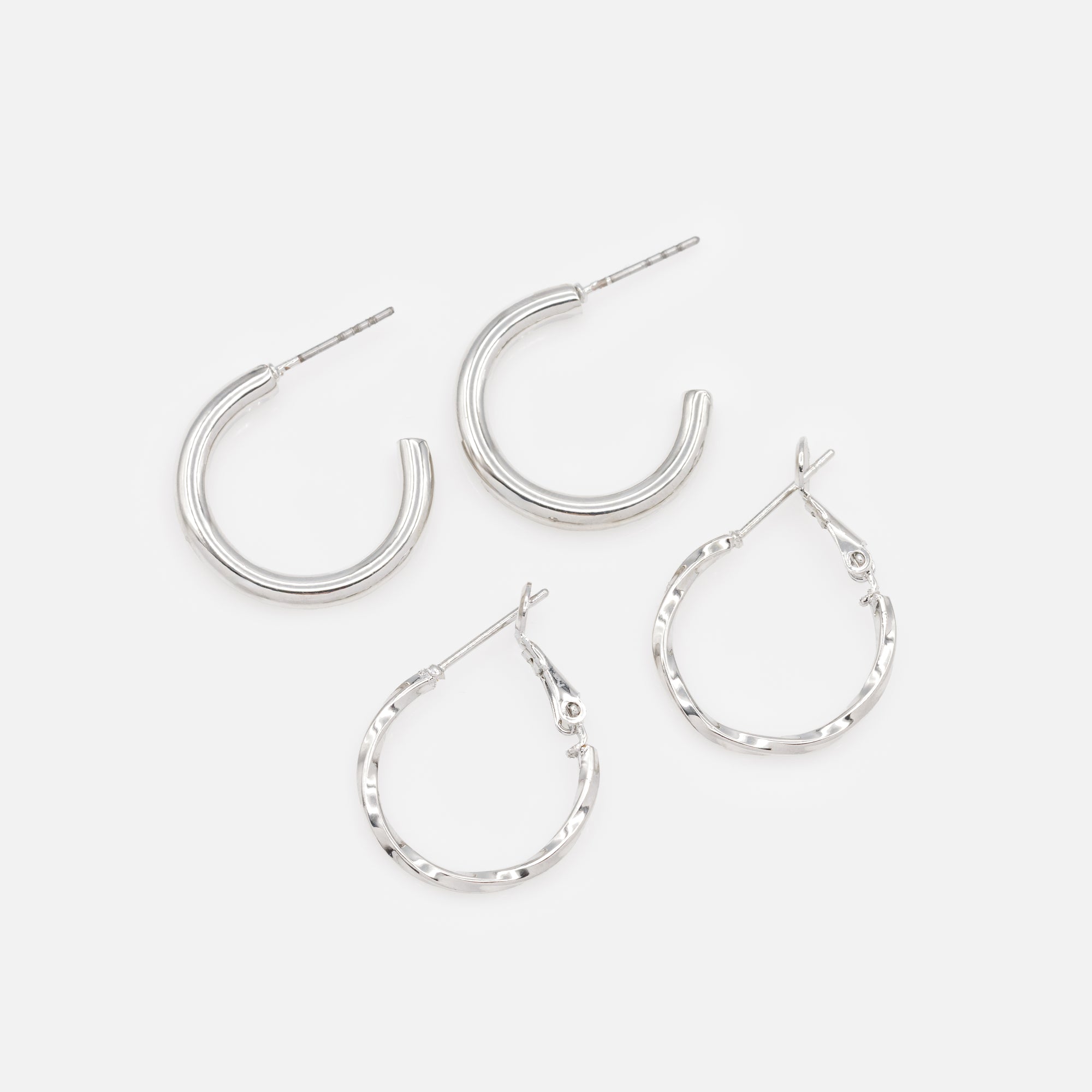 Duo of plain and twisted silver hoop earrings