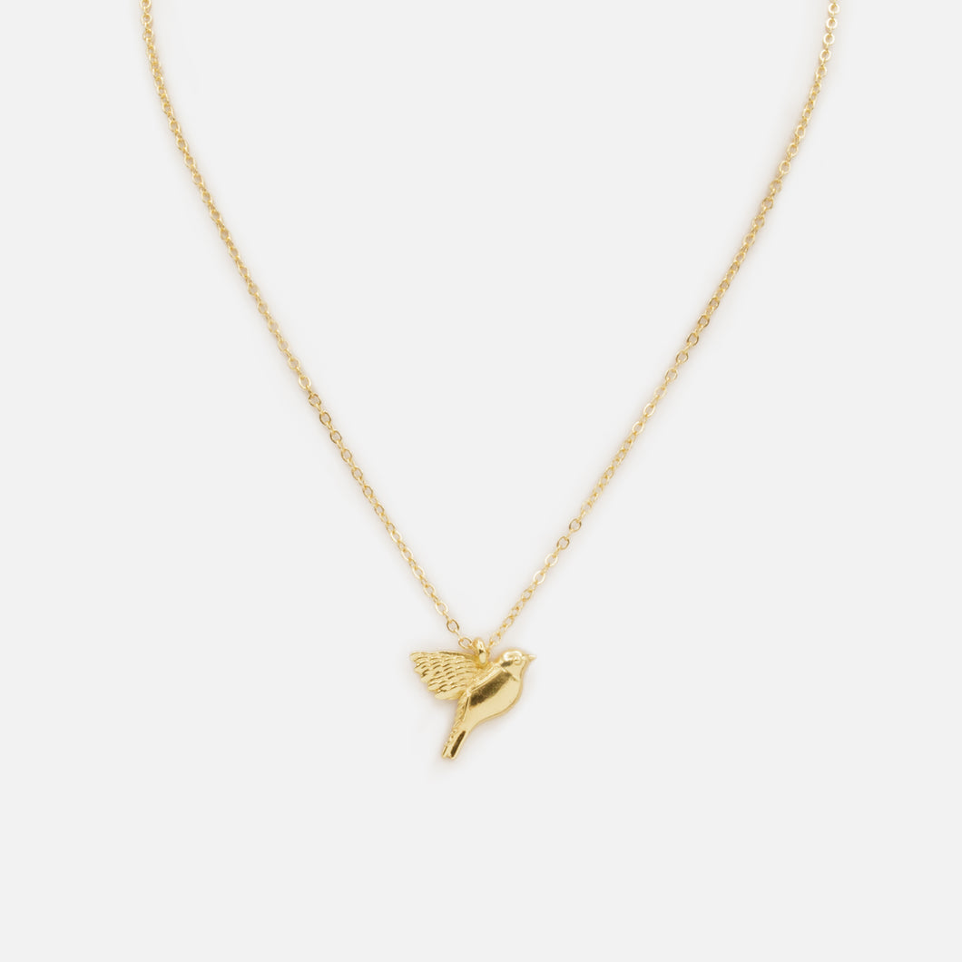 Collier doré avec breloque oiseau