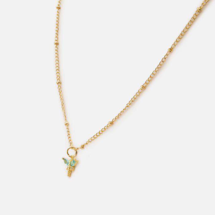 Collier doré avec breloque libellule aux ailes turquoise