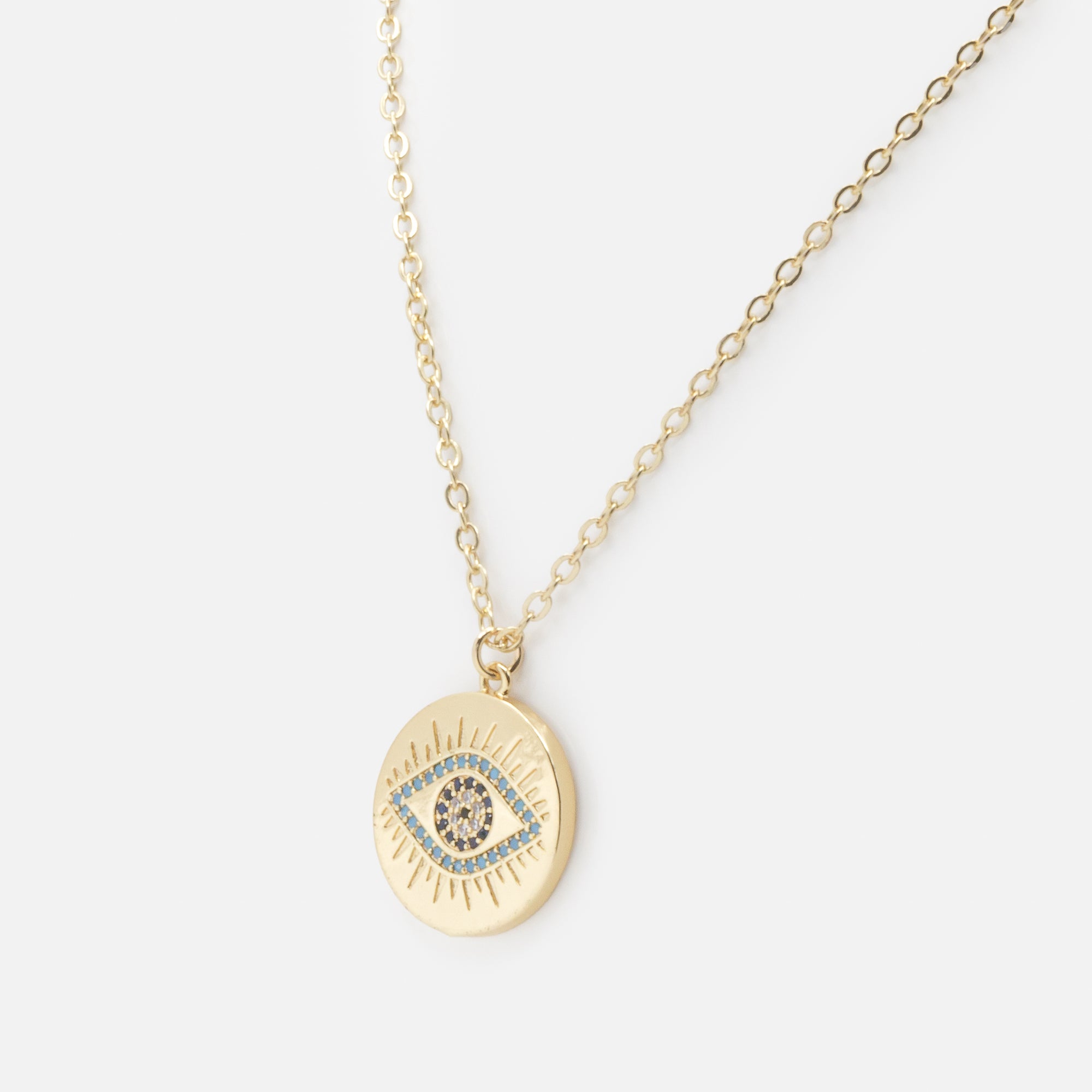Collier doré avec breloque oeil protecteur et zircons cubiques turquoise