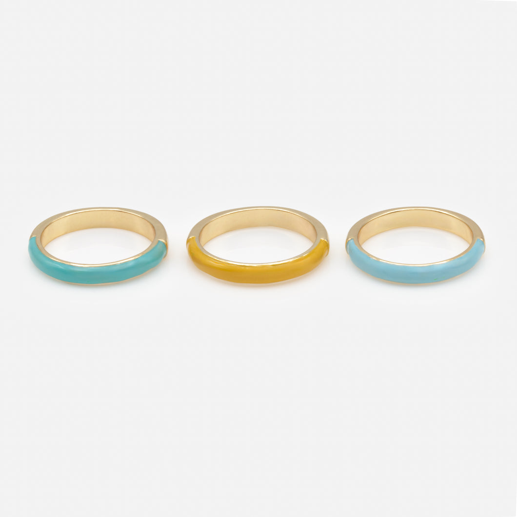 Trio of gold rings with colored band