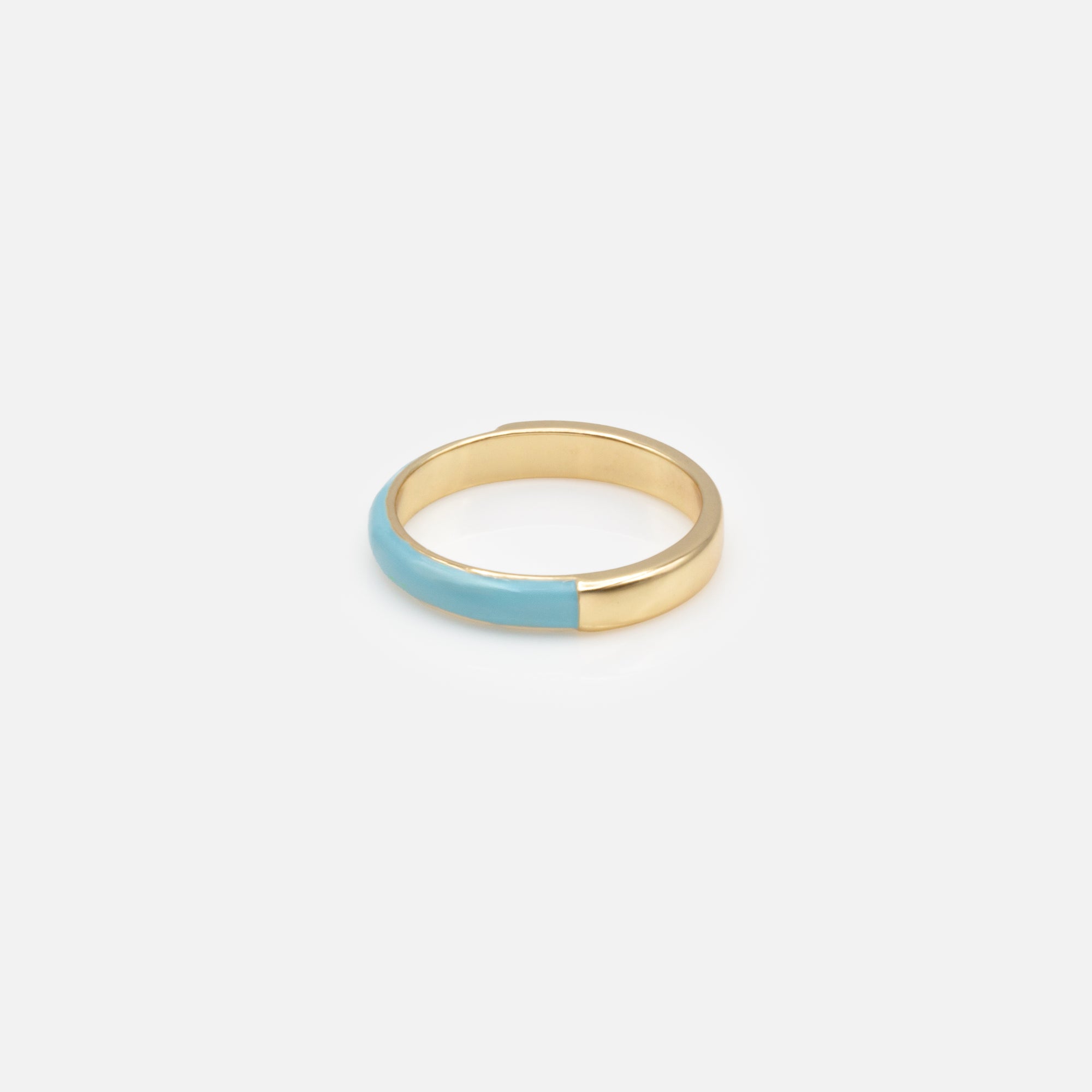 Trio of gold rings with colored band