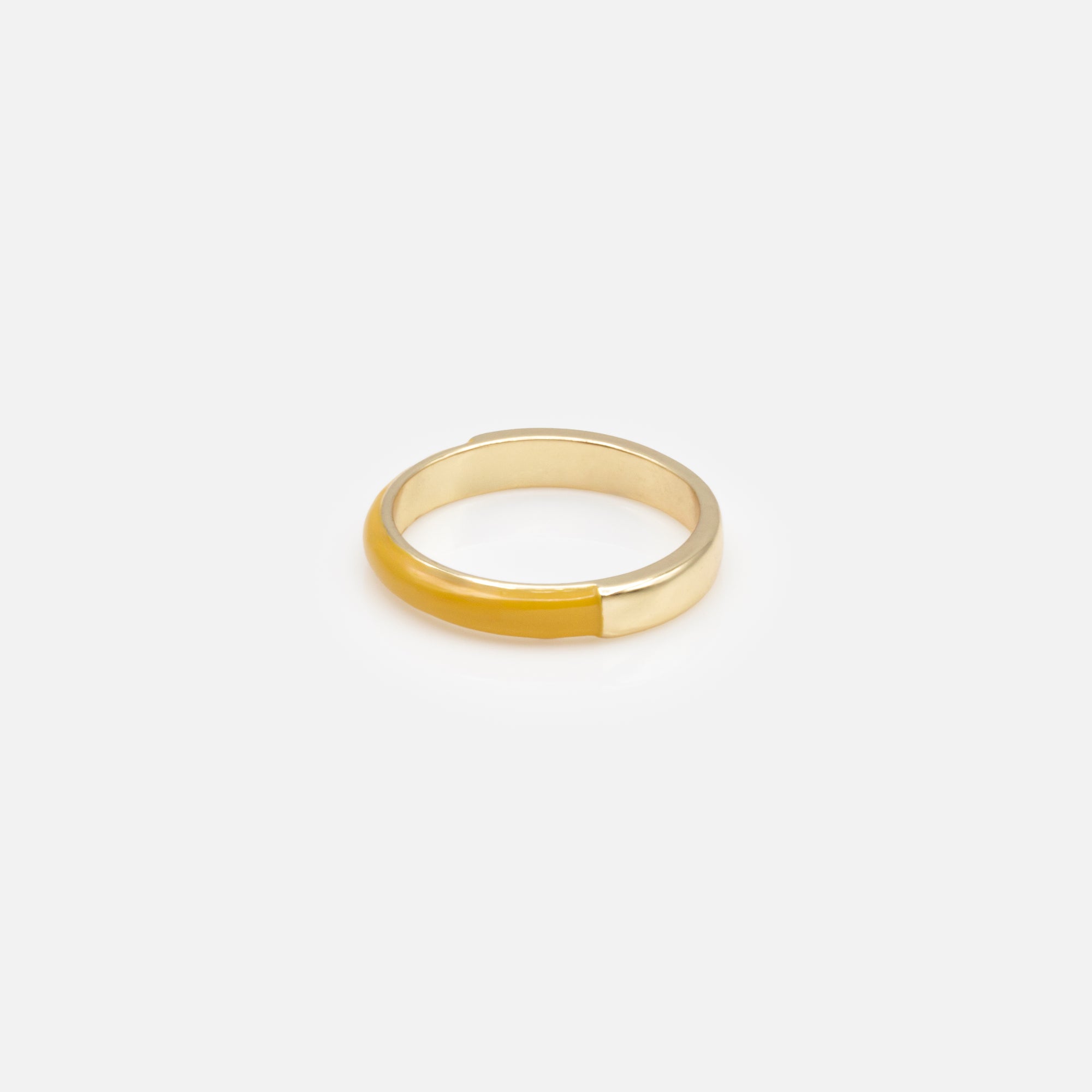 Trio of gold rings with colored band
