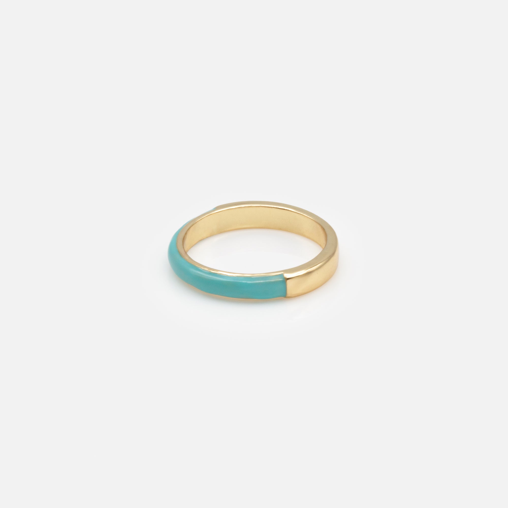 Trio of gold rings with colored band