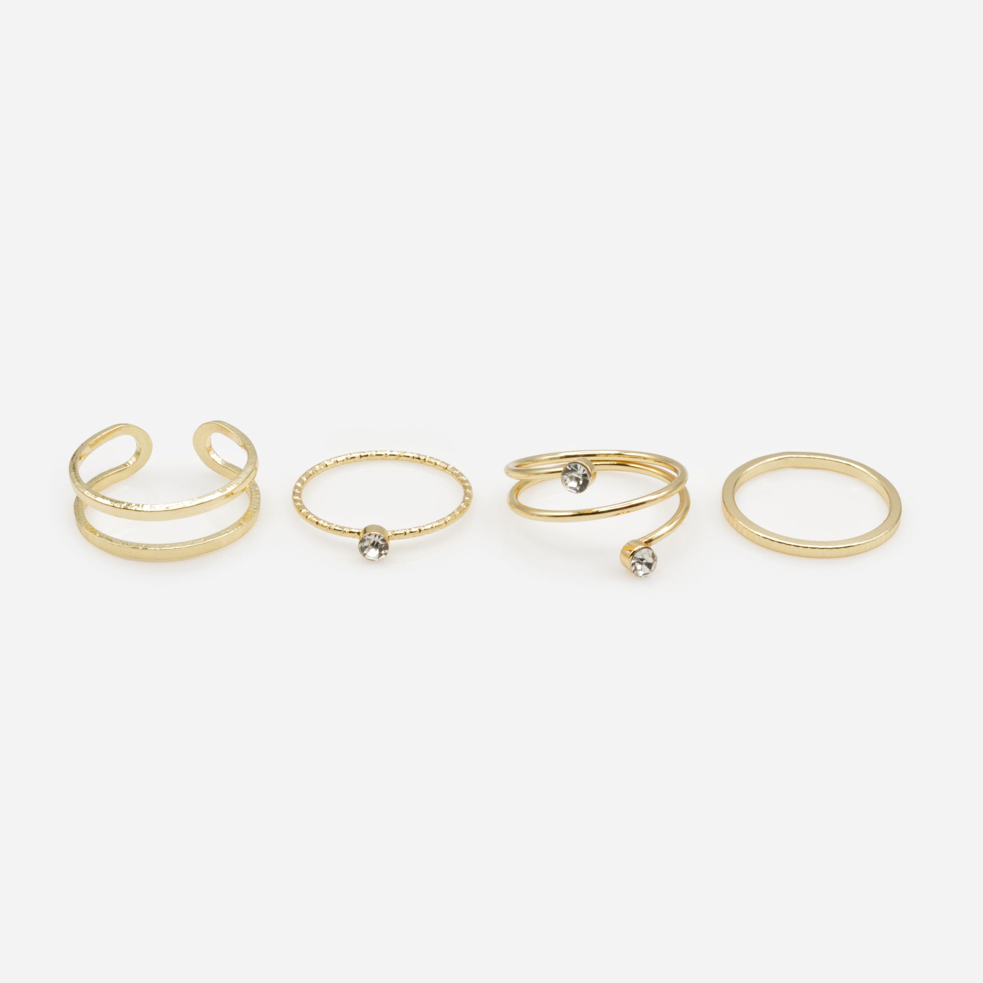 Set of four gold rings in various sizes with texture and cubic zirconia