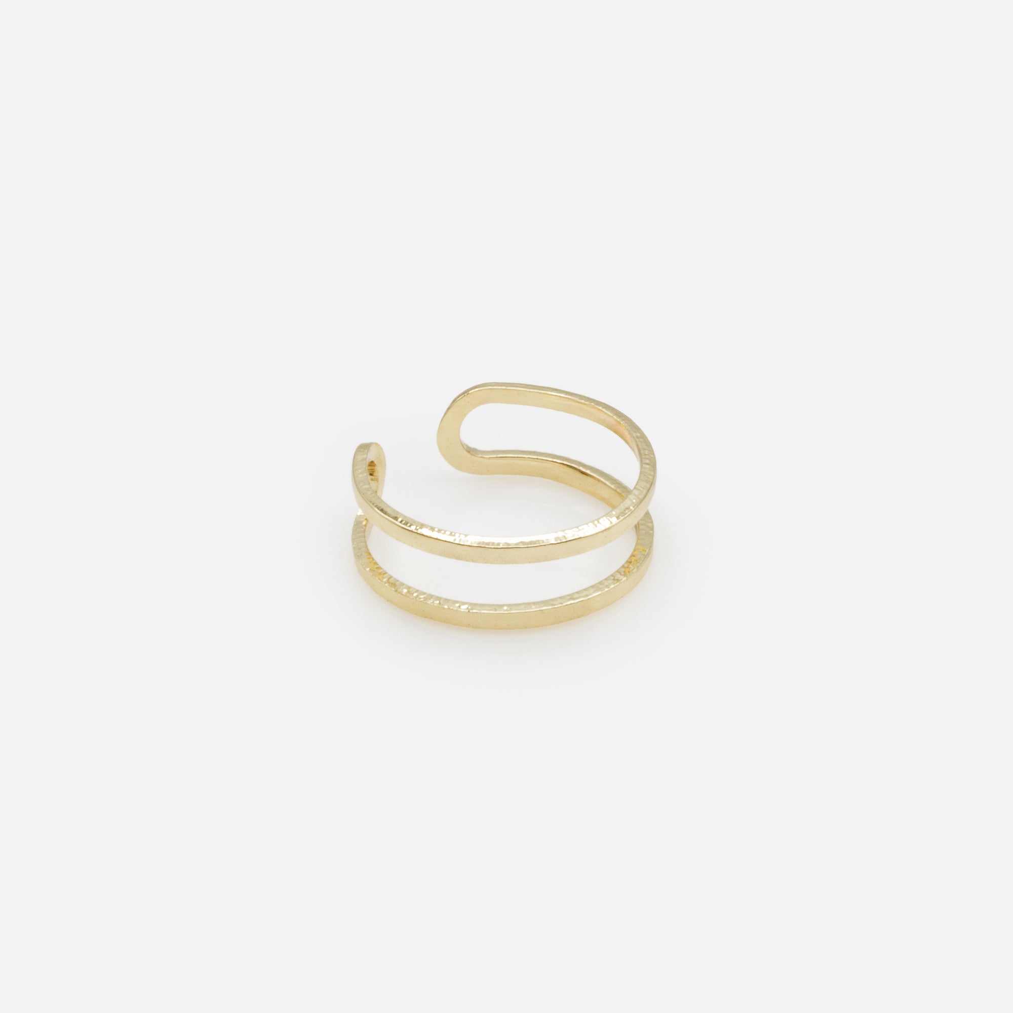 Set of four gold rings in various sizes with texture and cubic zirconia