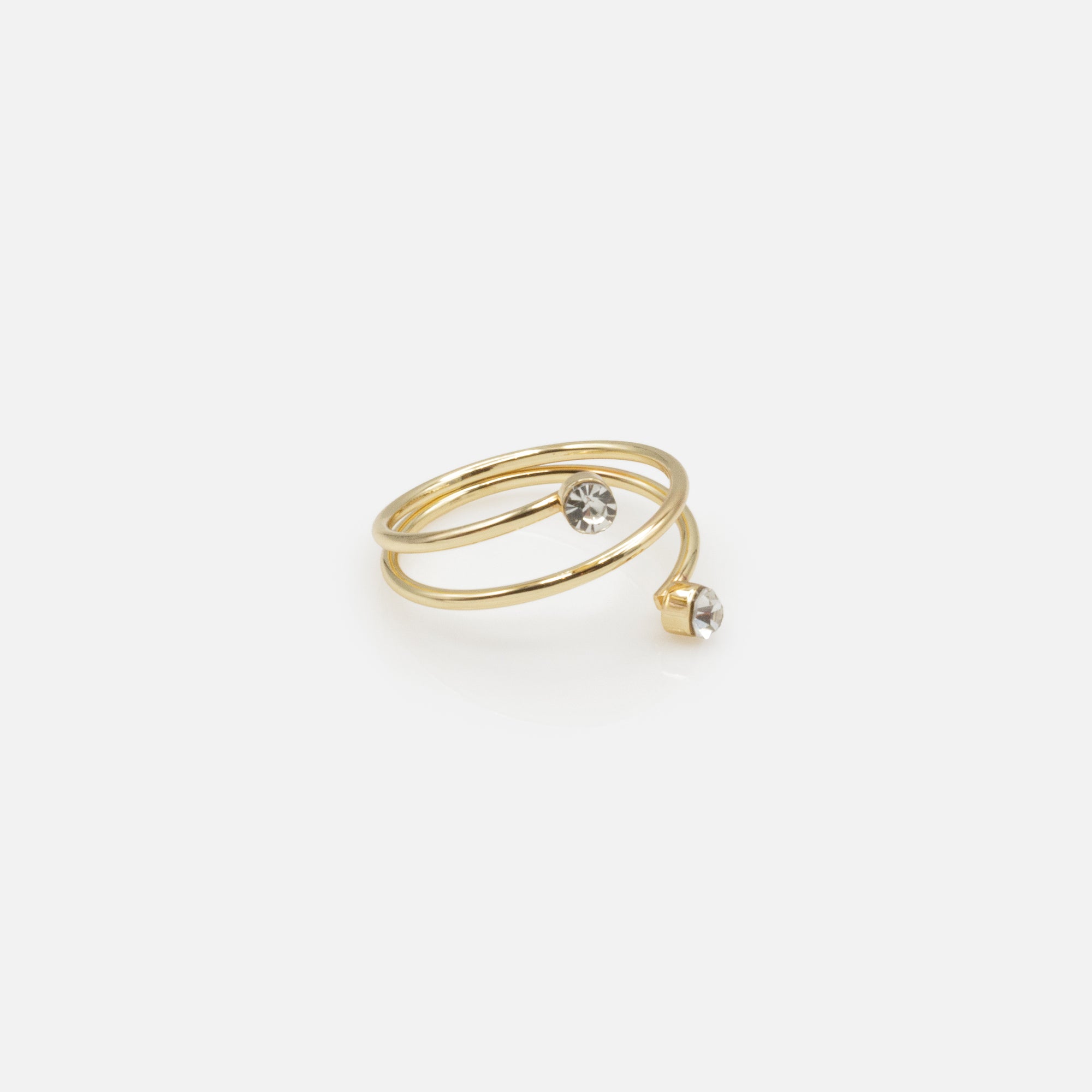 Set of four gold rings in various sizes with texture and cubic zirconia