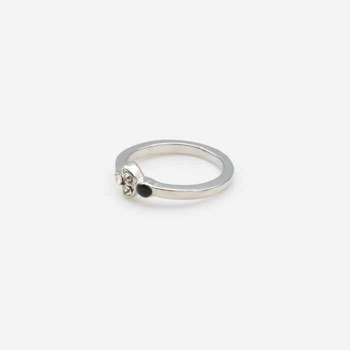 Set of four silver rings in various sizes with black and translucent zircons