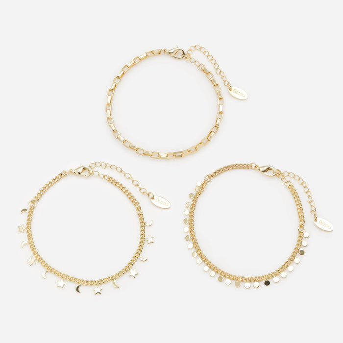 Trio of gold bracelets with moon, star and circle charms