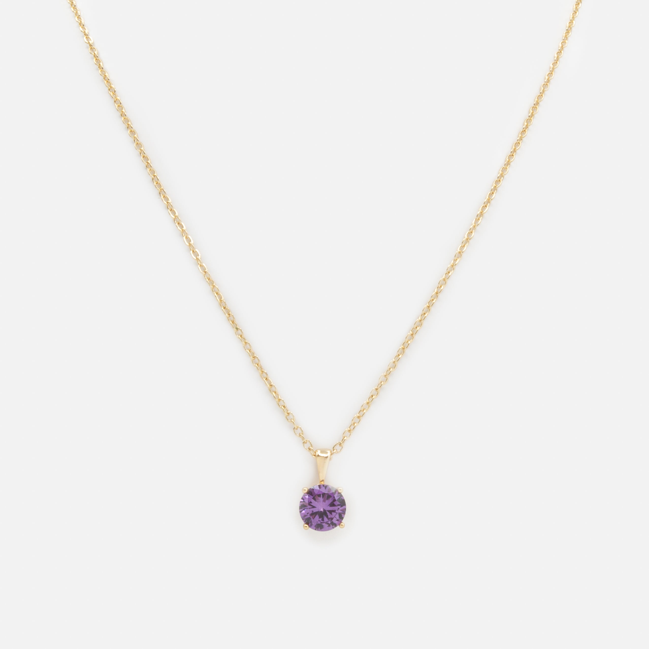 Gold necklace with purple stone charm
