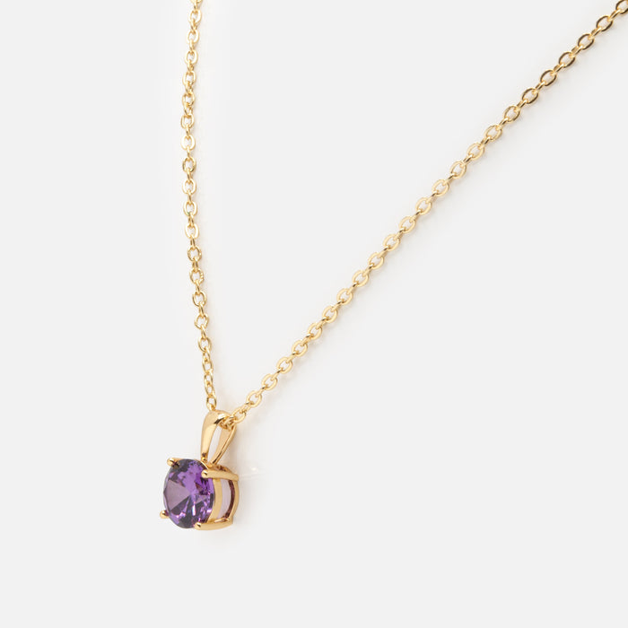 Gold necklace with purple stone charm