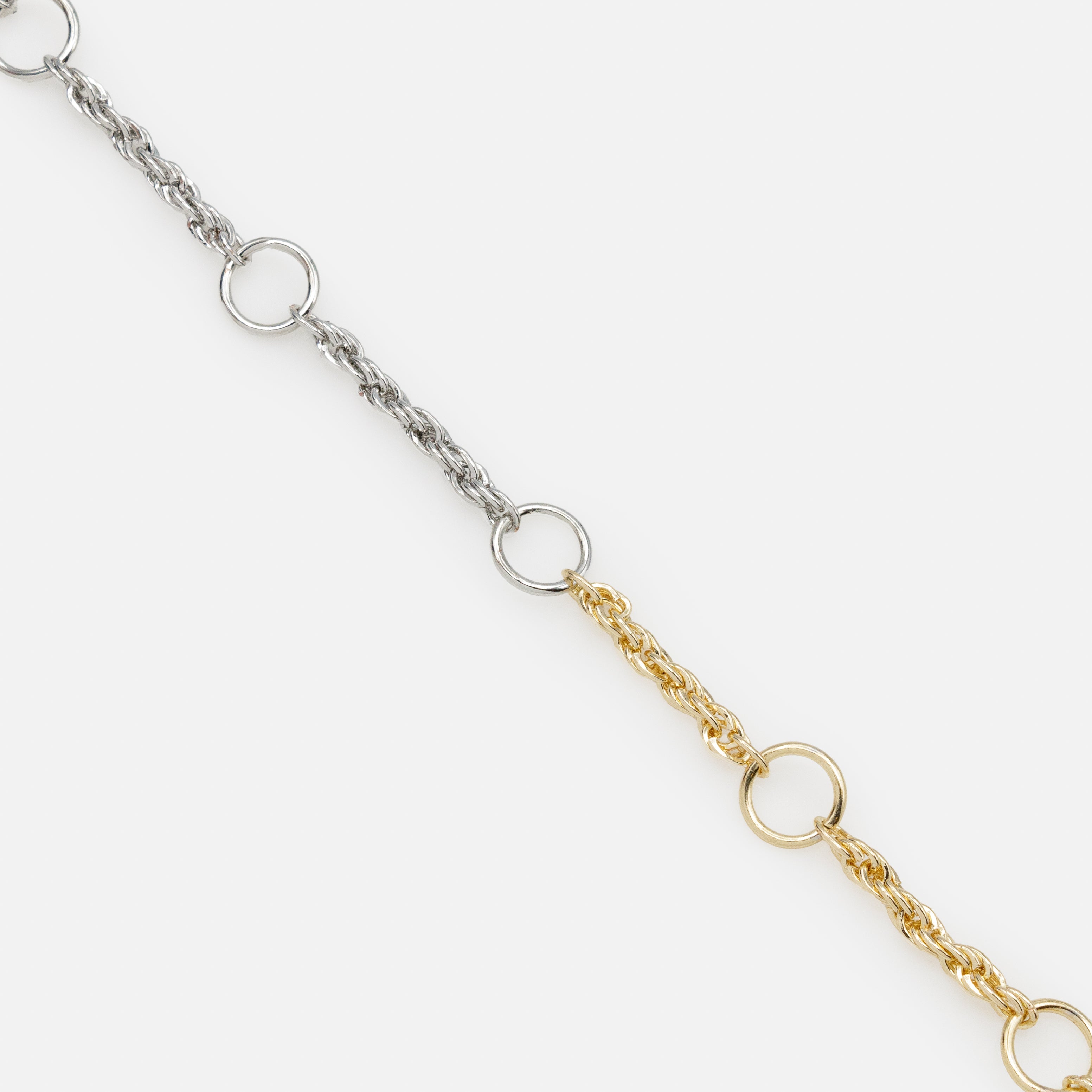 Twisted mesh and empty circles two tone bracelet