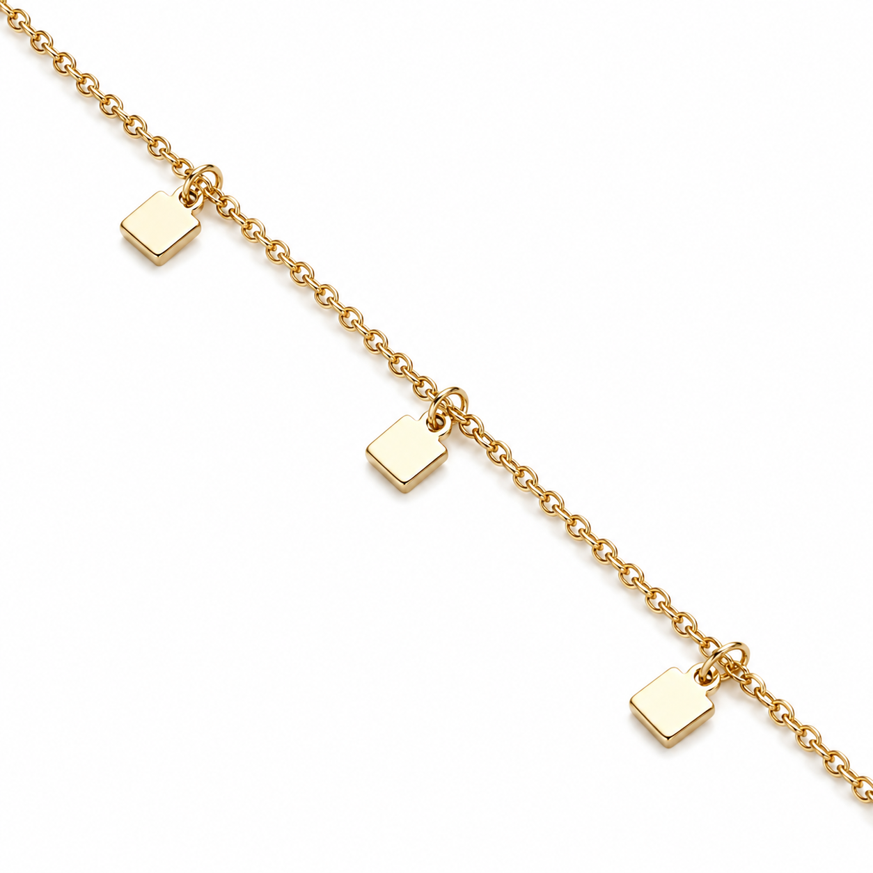 Gold bracelet with small square charms