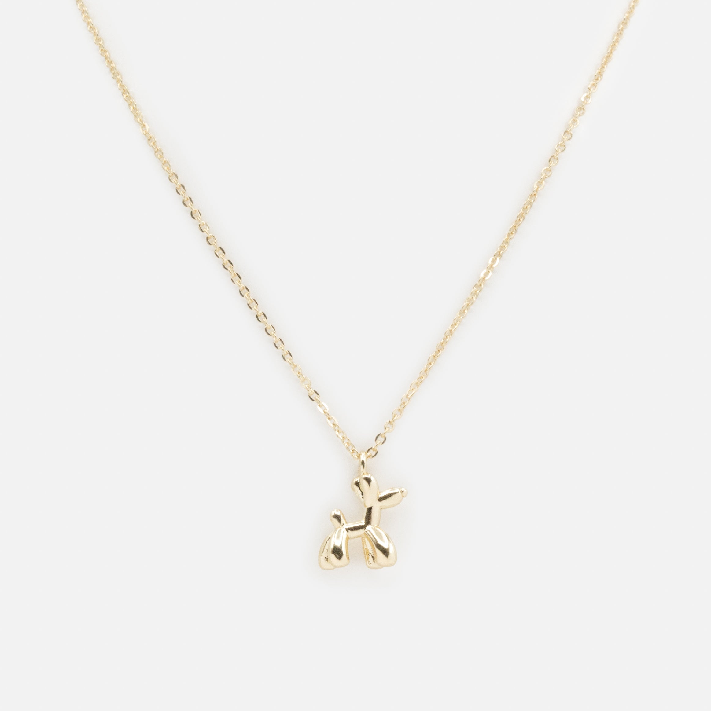 Collier doré breloque petit chien