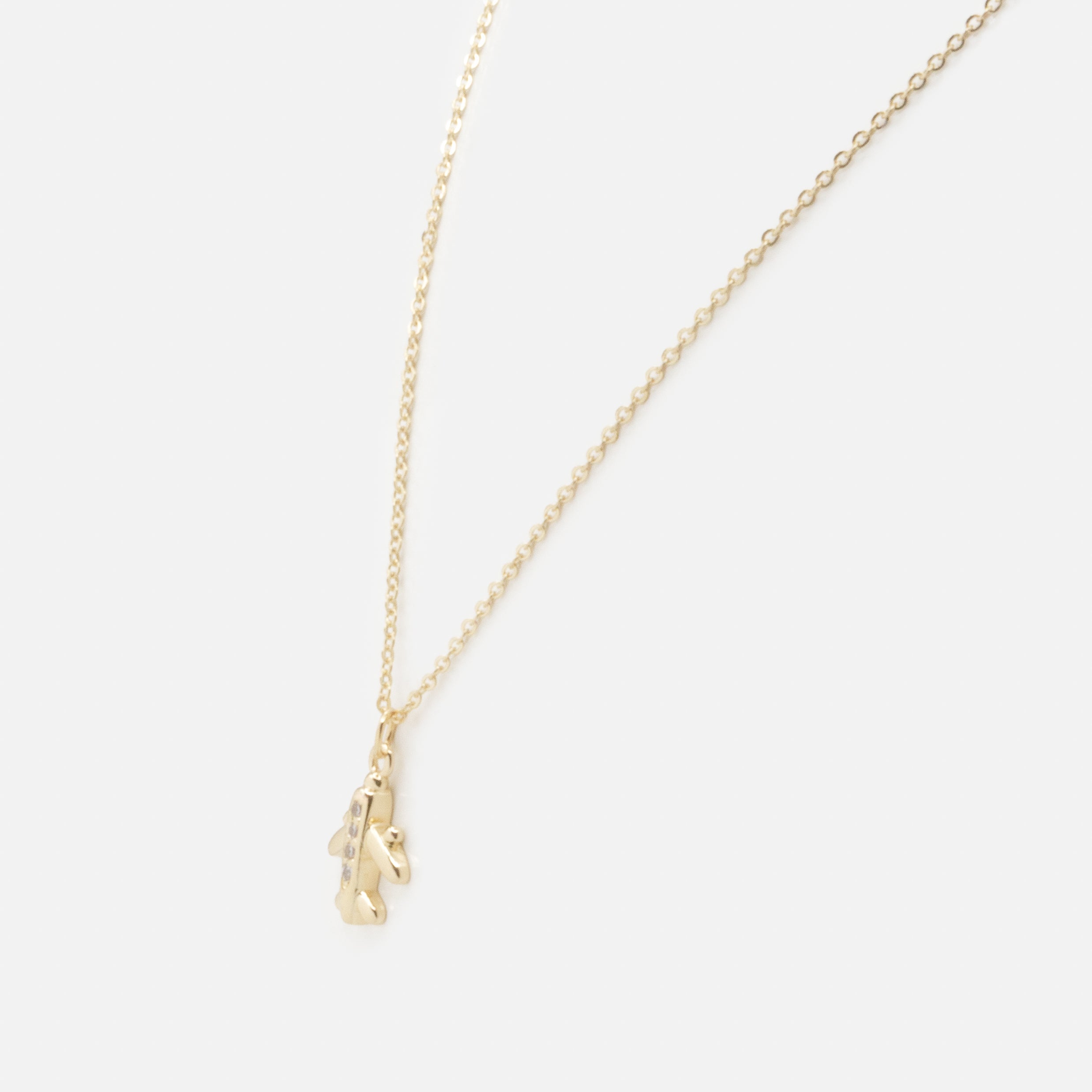 Collier doré breloque petit avion avec zircons cubiques