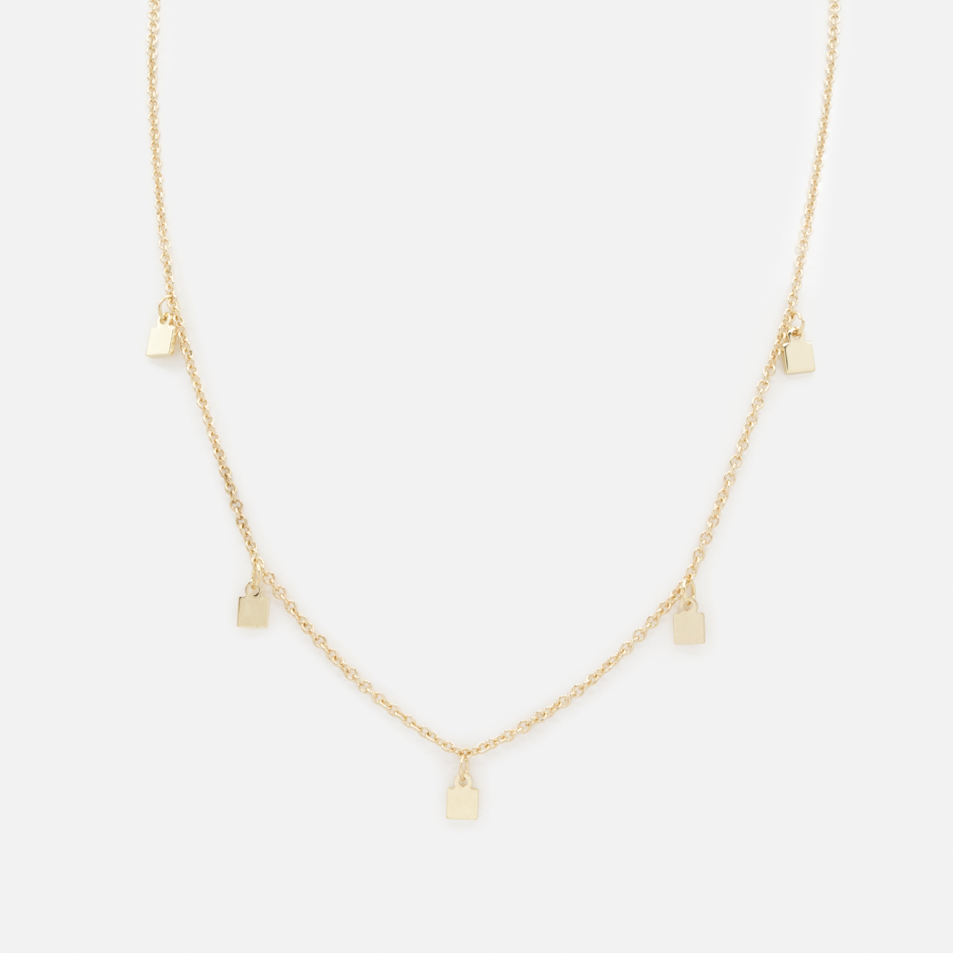 Collier doré petites breloques carrées