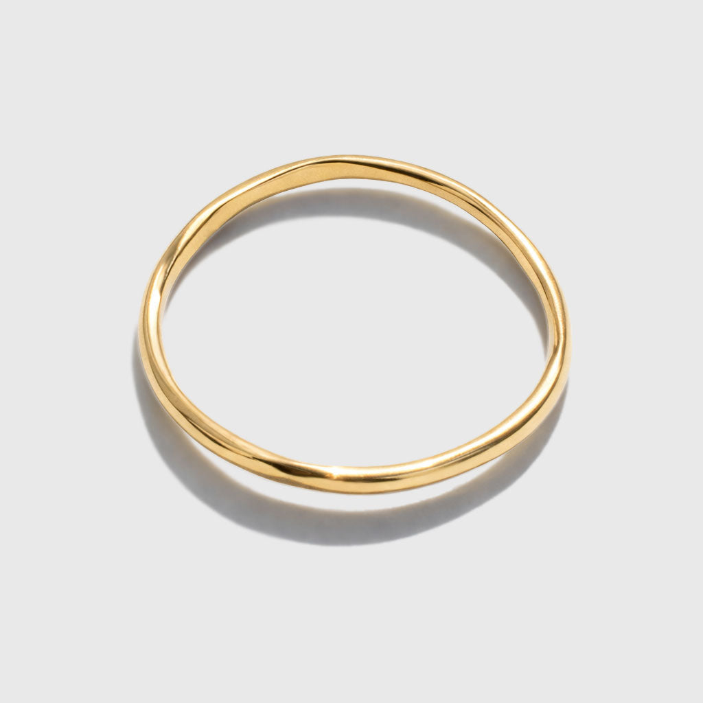 Bracelet jonc légèrement torsadé doré
