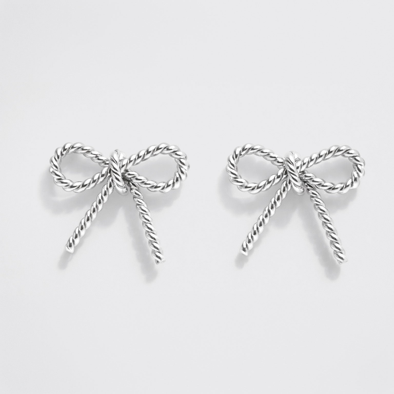 Boucles d'oreilles clous nœud texturé argenté