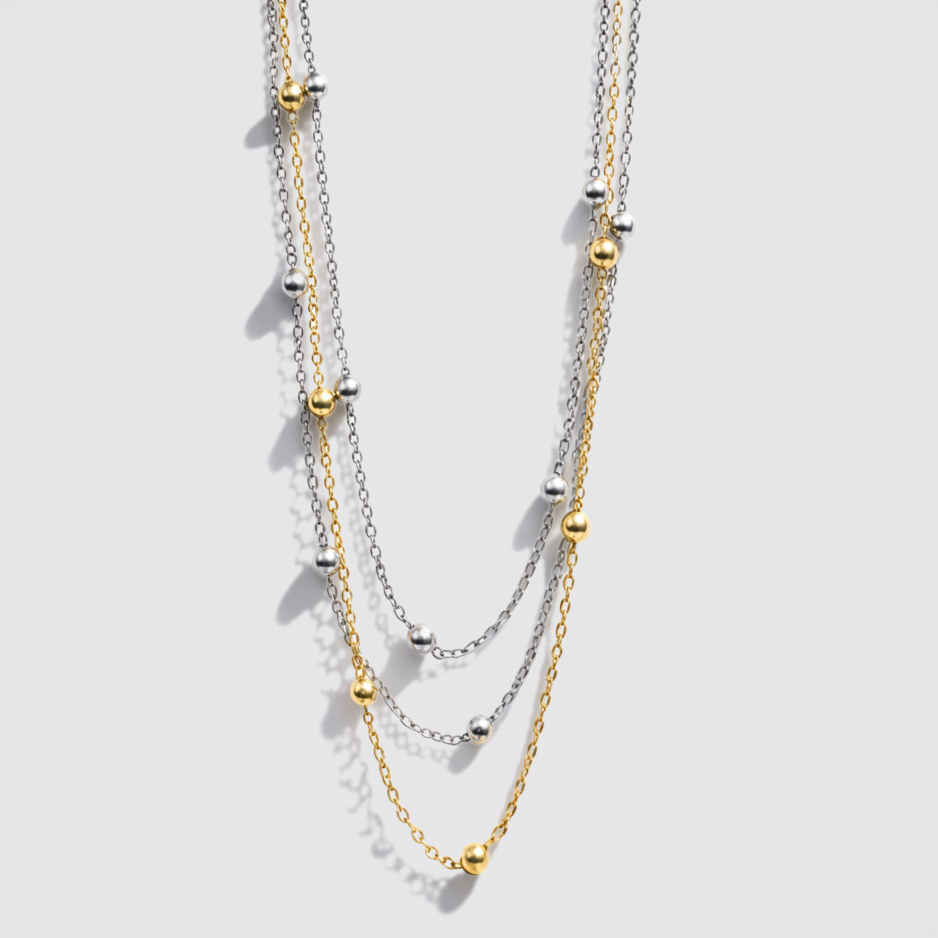 Collier trois rangs de perles bicolores