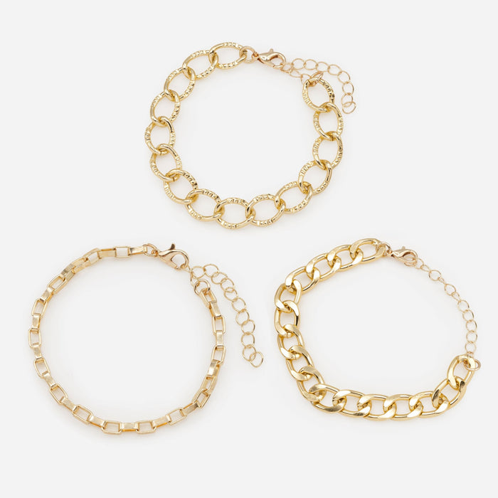 Trio of golden bracelets with varied links