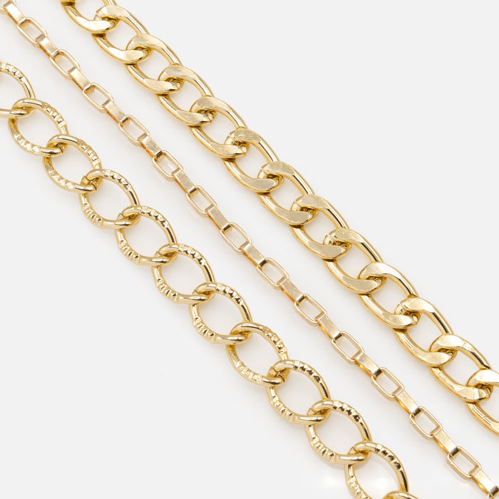Trio of golden bracelets with varied links
