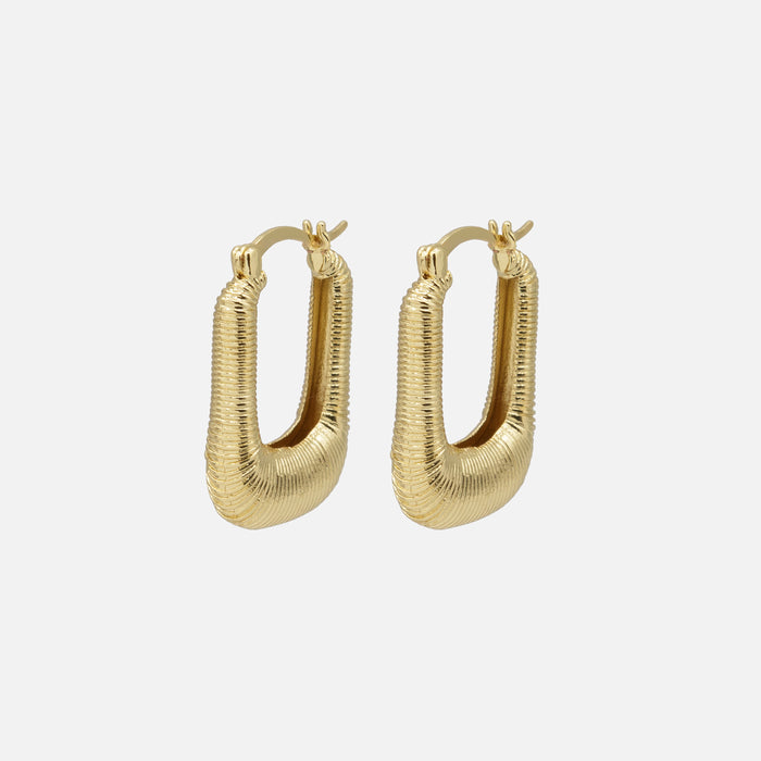 Oval grooved gold earrings