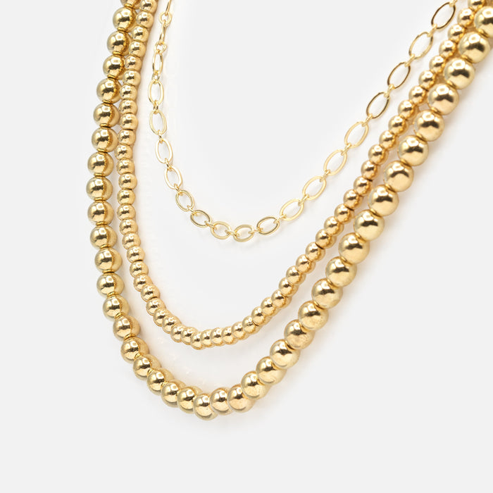 Triple chain gold necklace