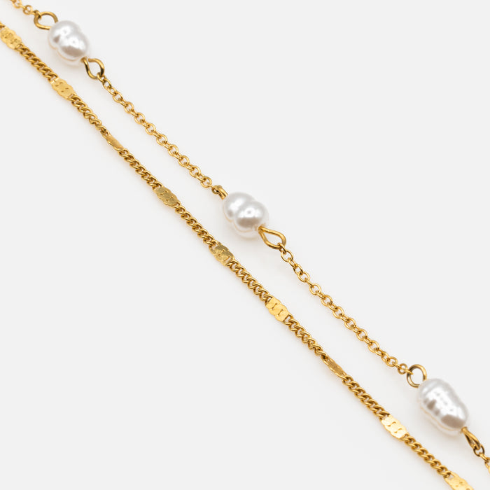 Bracelet doré avec perles et insertions plates en acier inoxydable