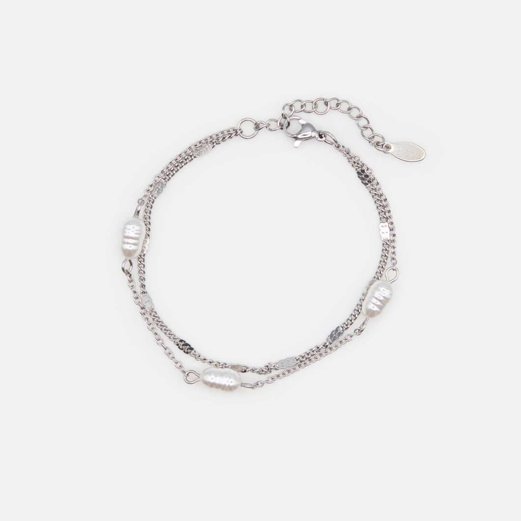 Silver bracelet with pearls and flat inserts in stainless steel