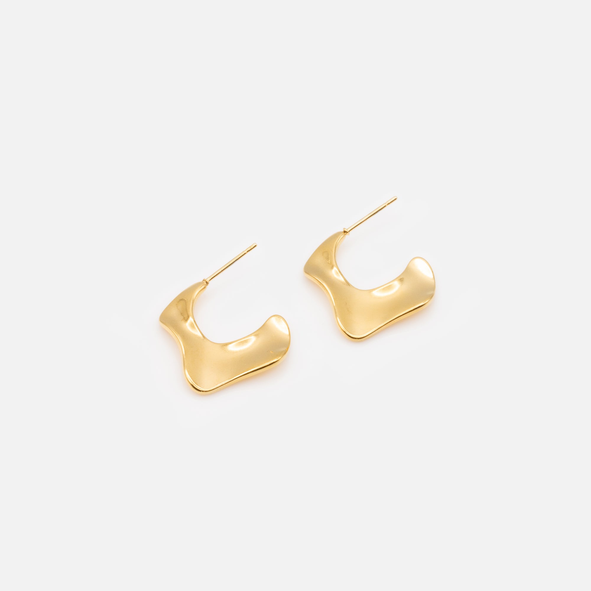 Gold earrings with abstract contours in stainless steel