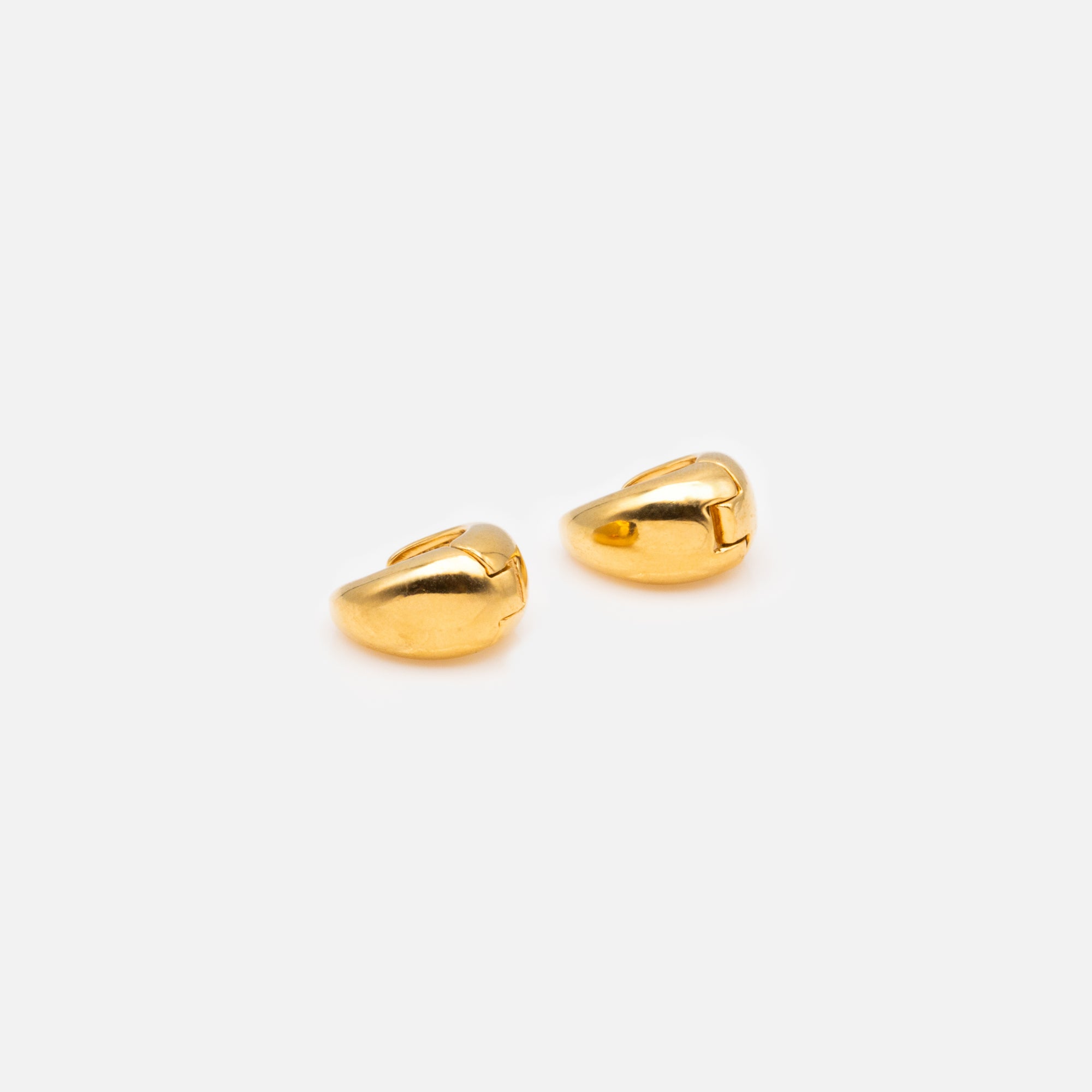 Small gold oval earrings with a wide base in stainless steel