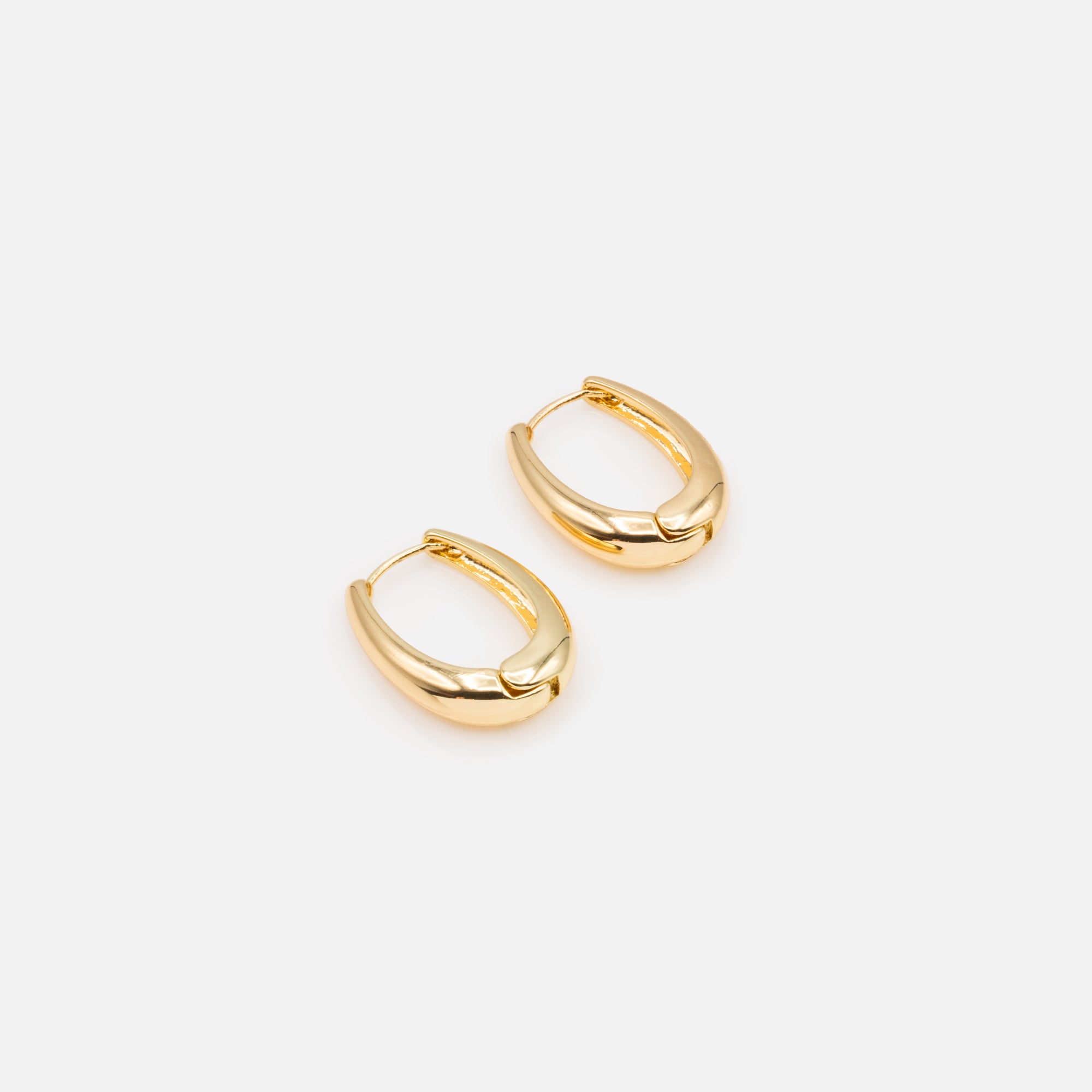 Small gold oval earrings with a wide base in stainless steel