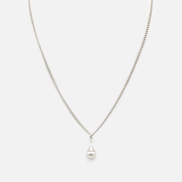 Silver pendant with stainless steel bead