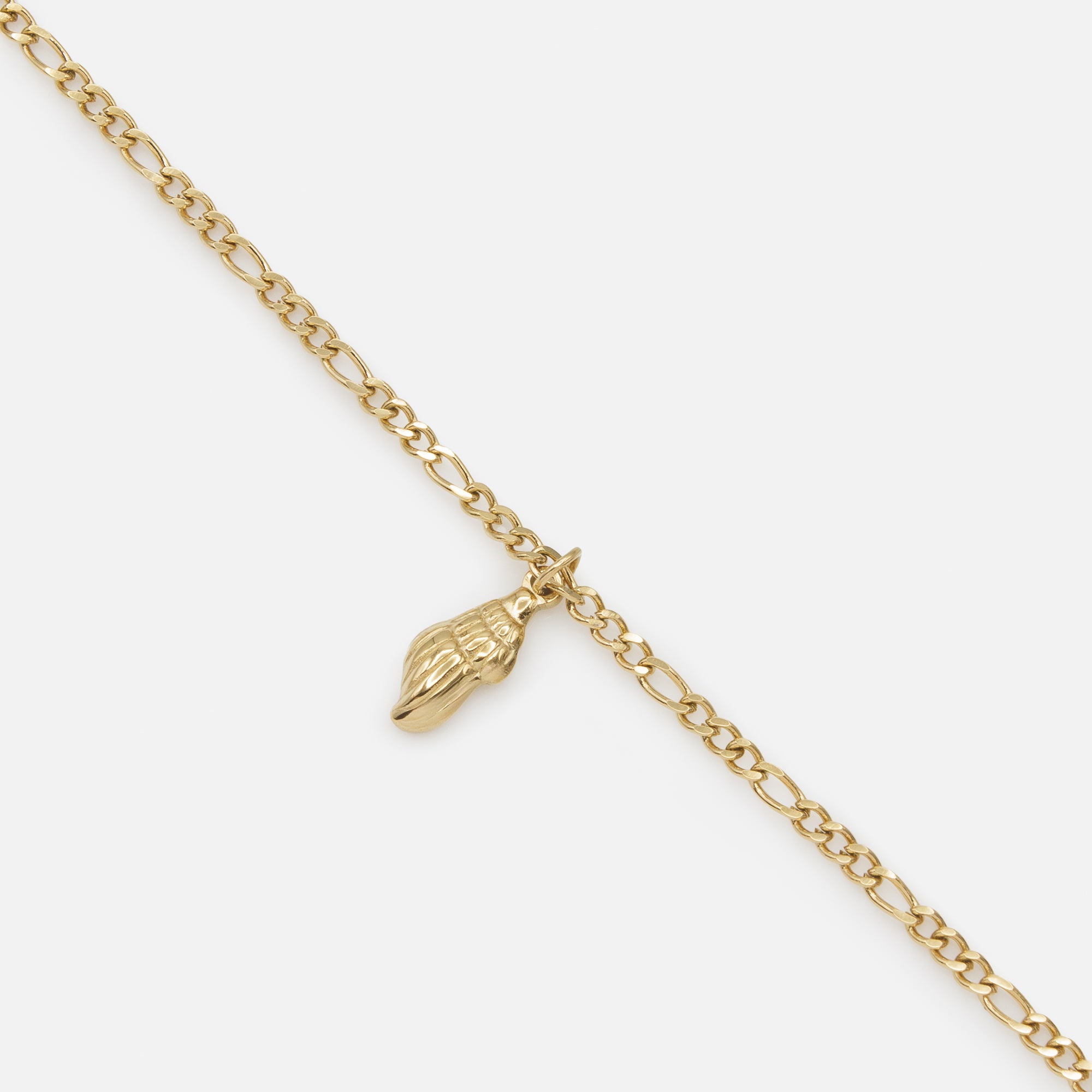 Gold figaro link bracelet with stainless steel shell charm