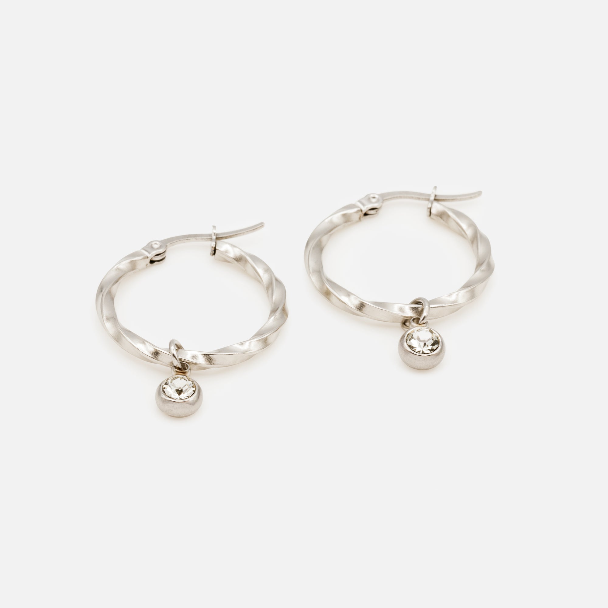 Twisted silver hoop earrings with removable cubic zirconia charm in stainless steel