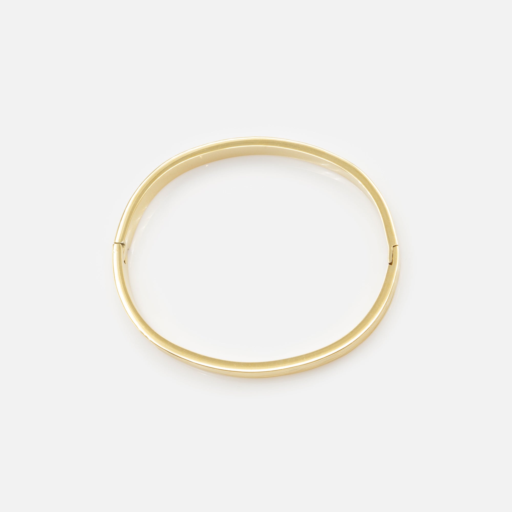 Bracelet rigide doré à rainures en acier inoxydable
