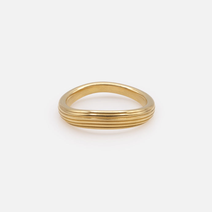 Curved grooved gold ring in stainless steel