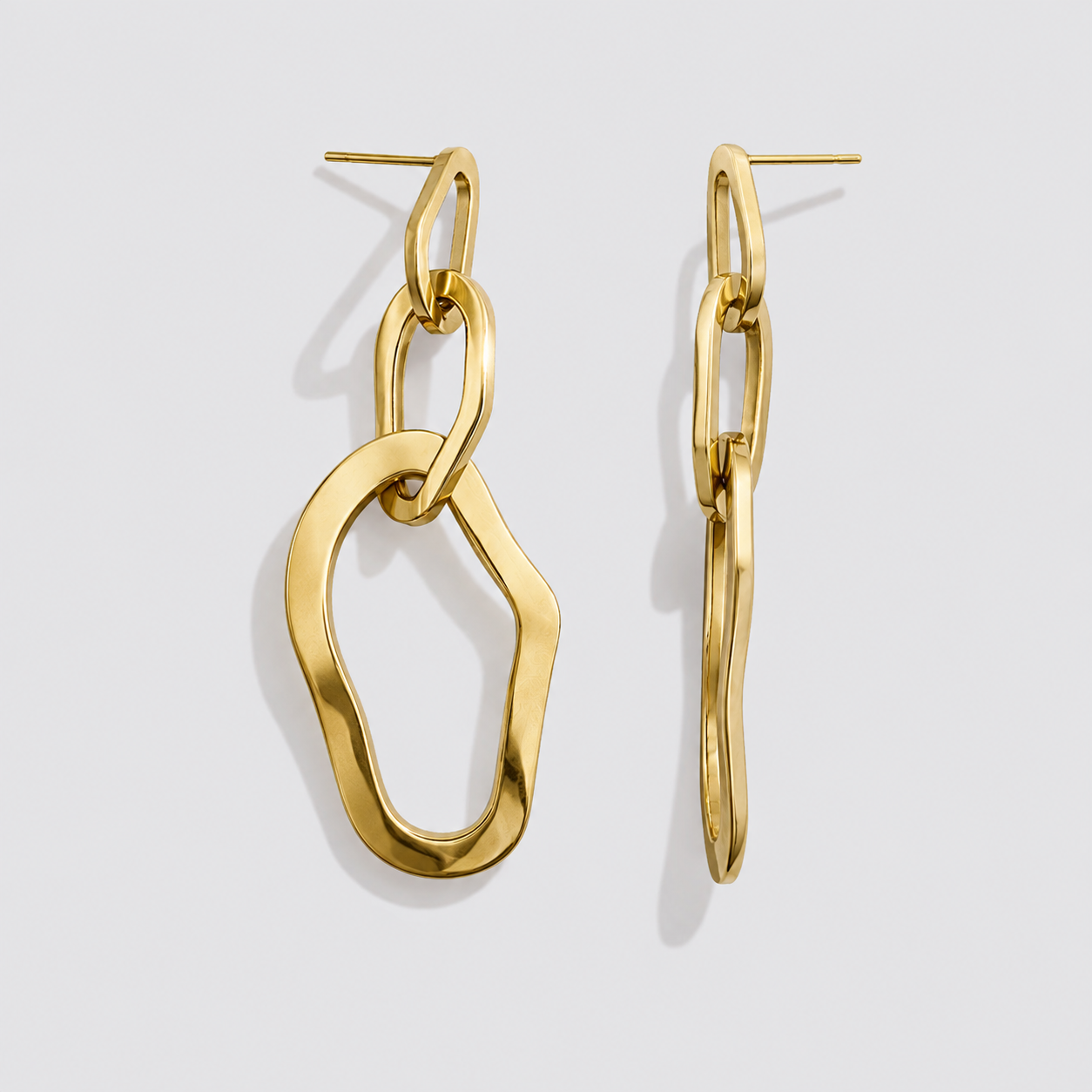 Boucles d'oreilles pendantes triple anneaux organiques dorés en acier inoxydable