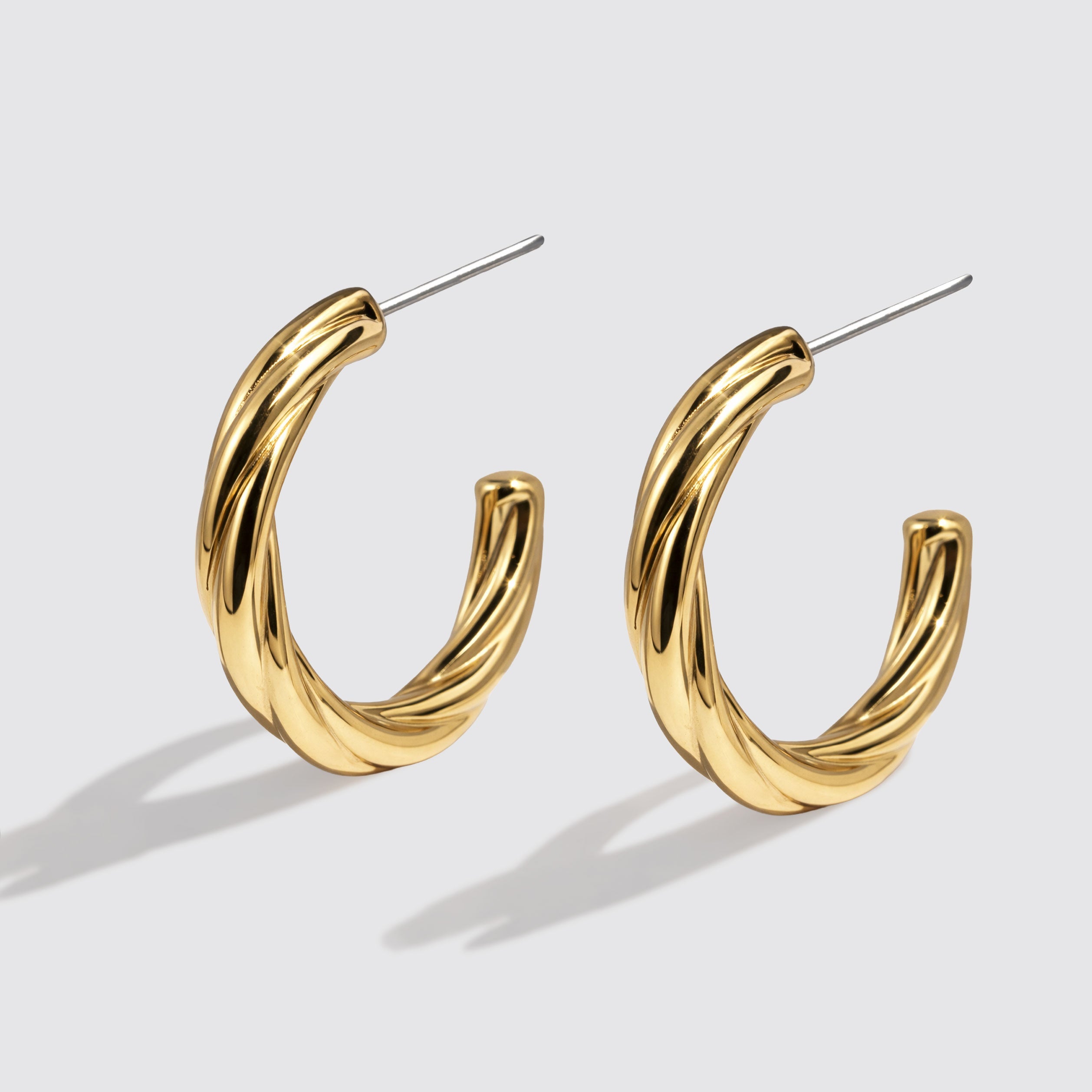 Boucles d'oreilles anneaux torsadés dorés en acier inoxydable