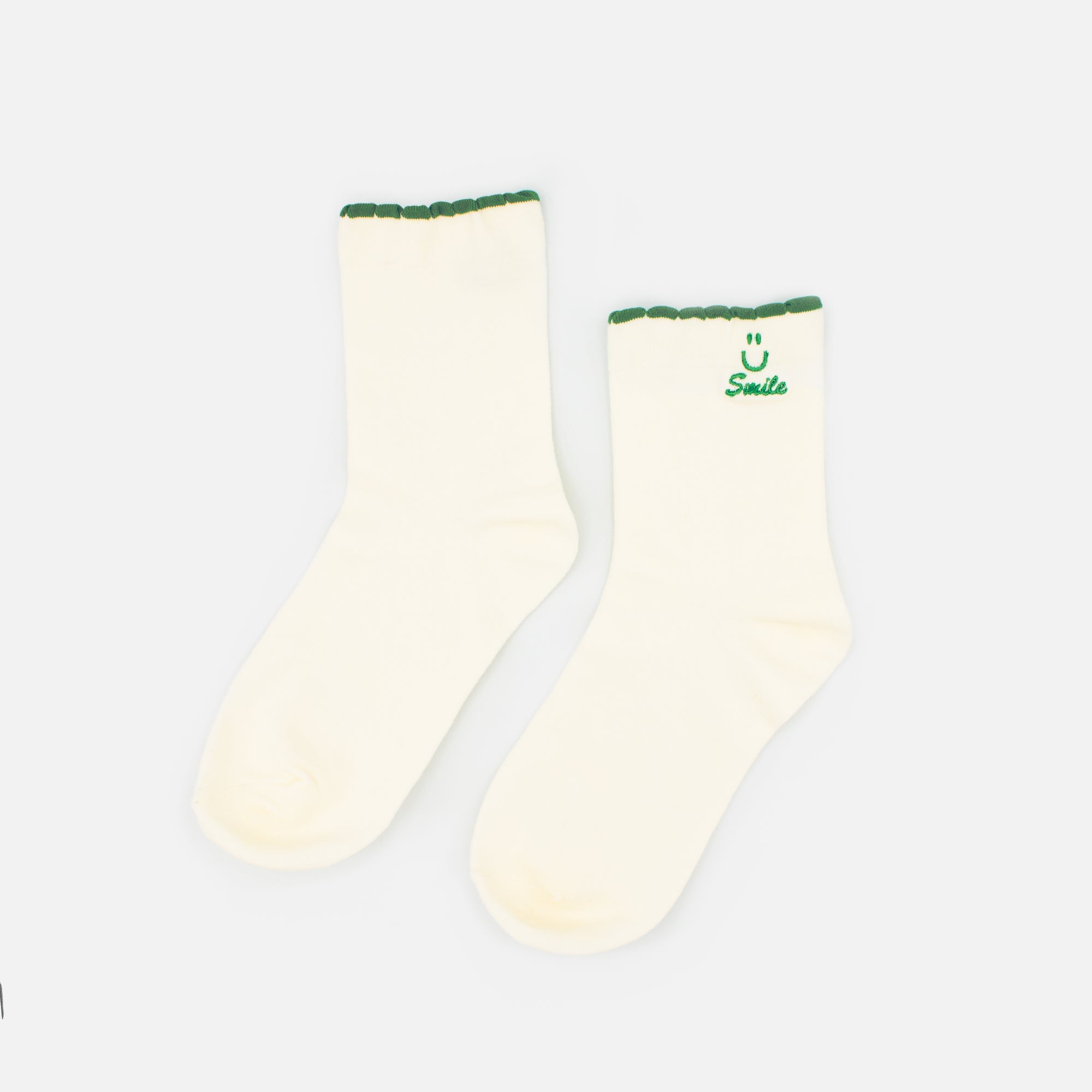 White stockings with Smile embroidery and green border