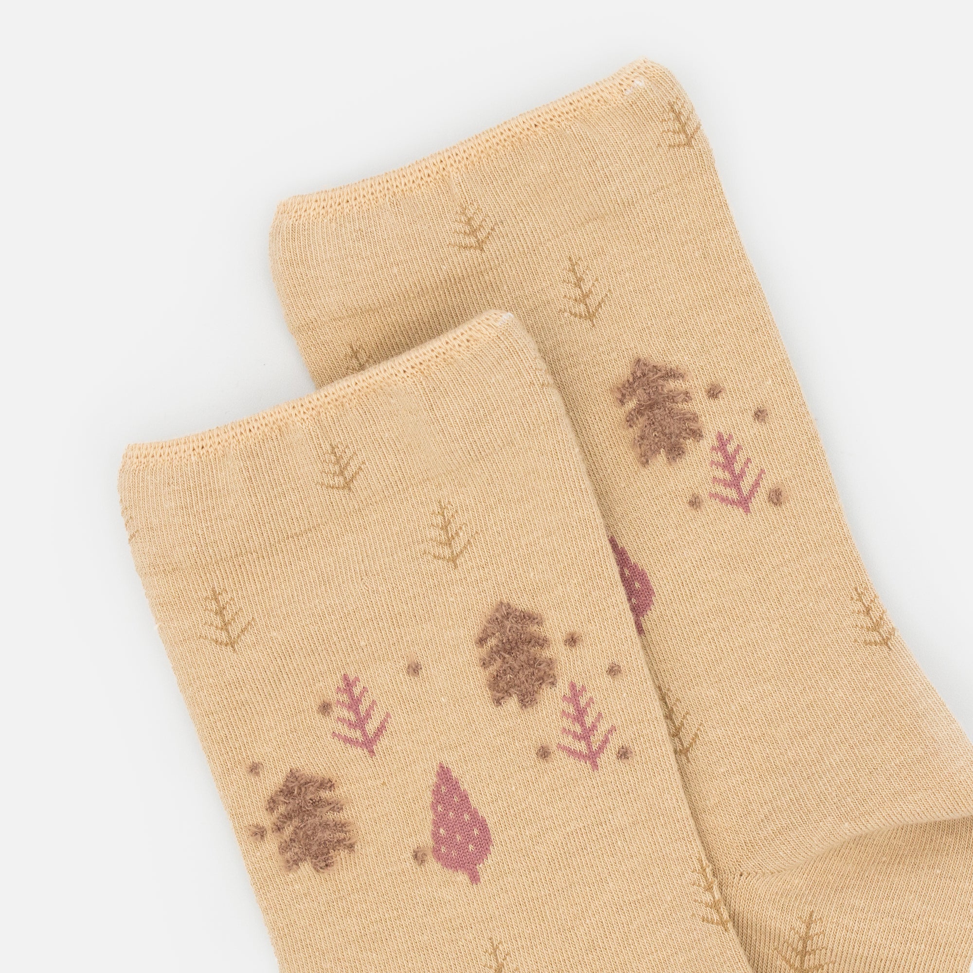 Beige stockings with tree print