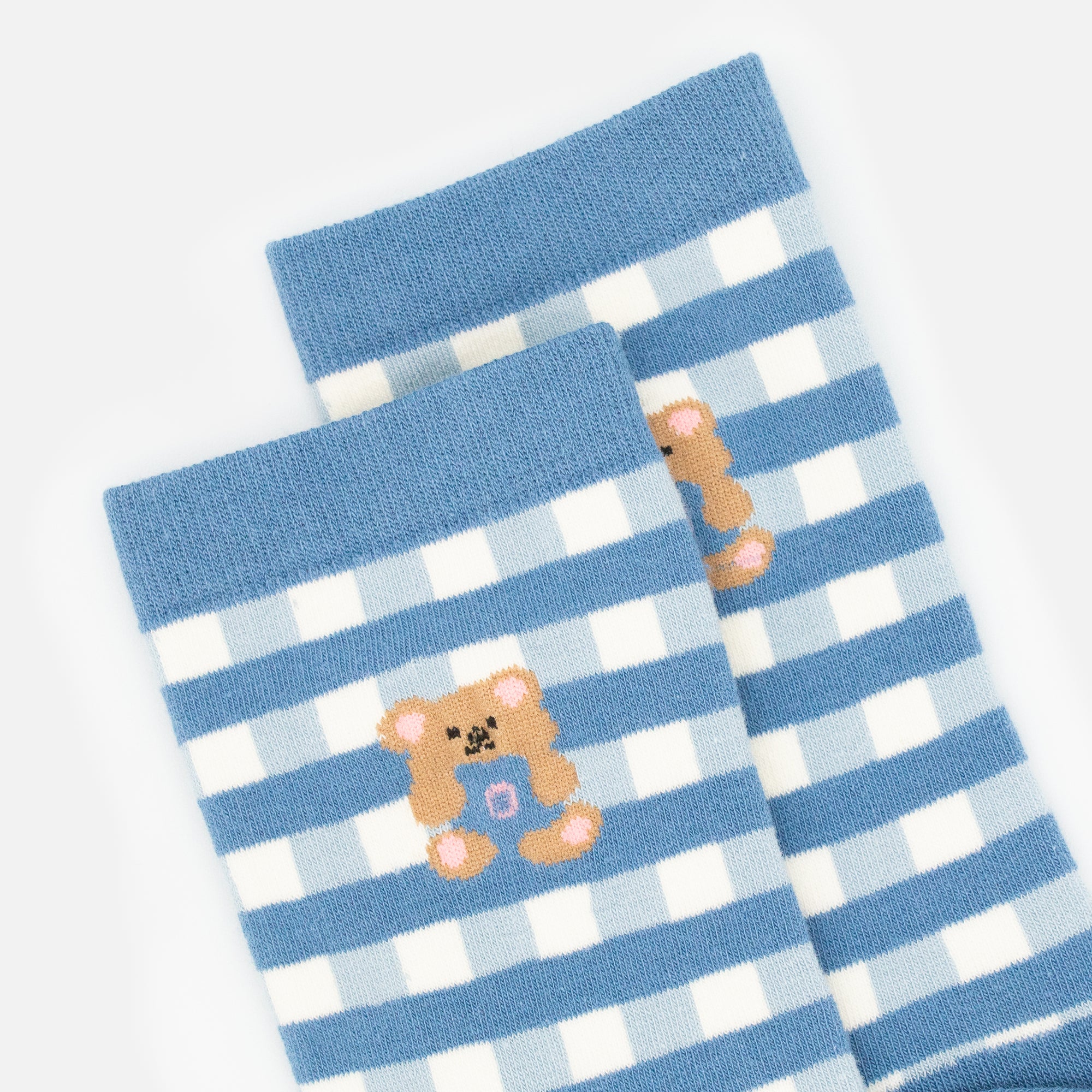 Blue and white checkered stockings with teddy bear