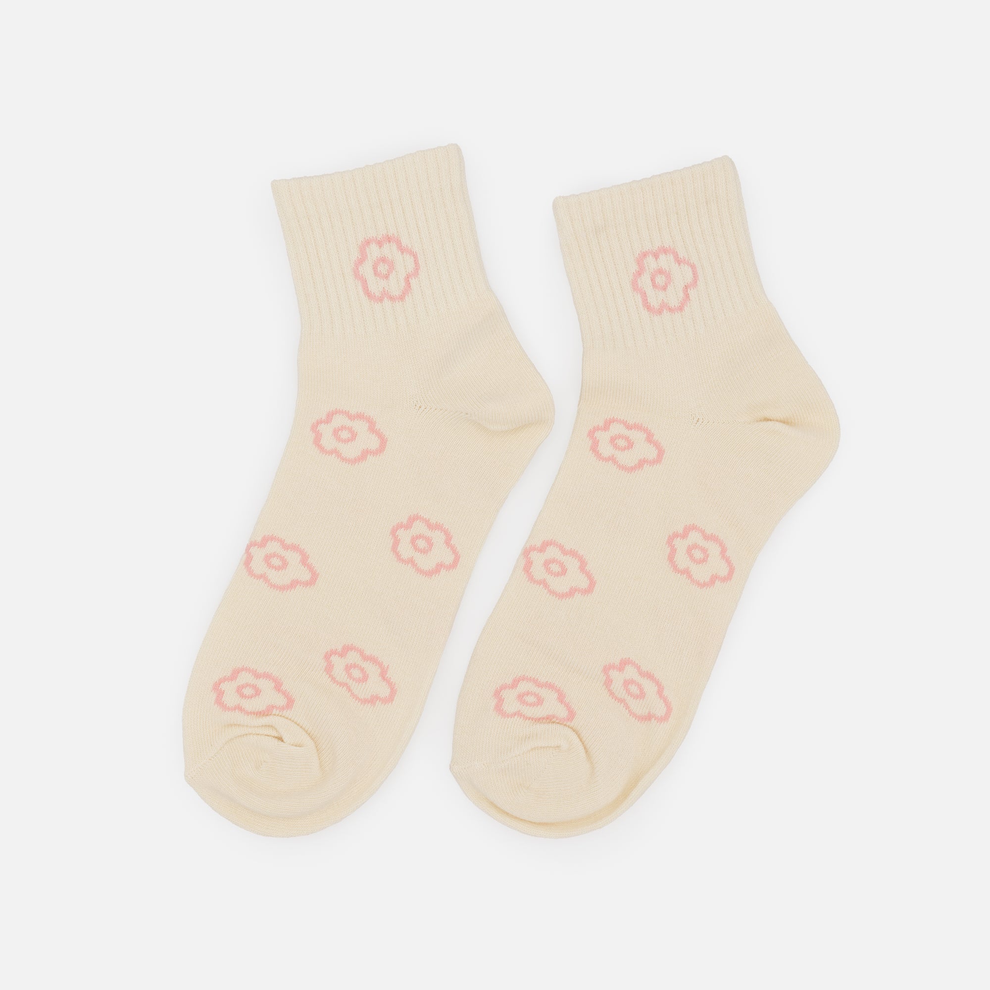 Mid-length cream stockings with pale pink empty flowers