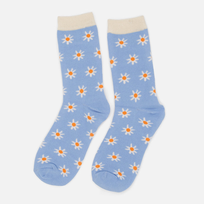 Bas bleu pâle avec fleurs blanches et bordure crème