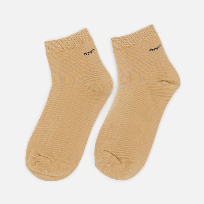 Mid-length beige stockings with closed eyes