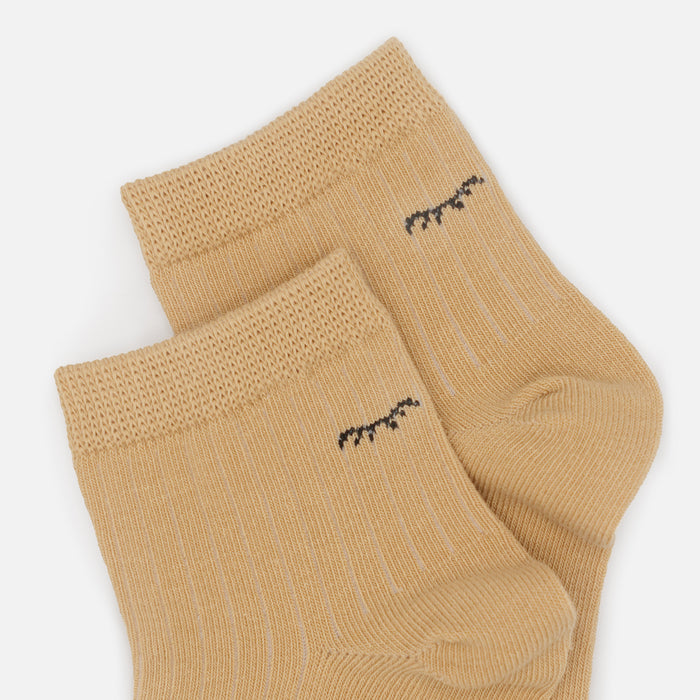 Mid-length beige stockings with closed eyes