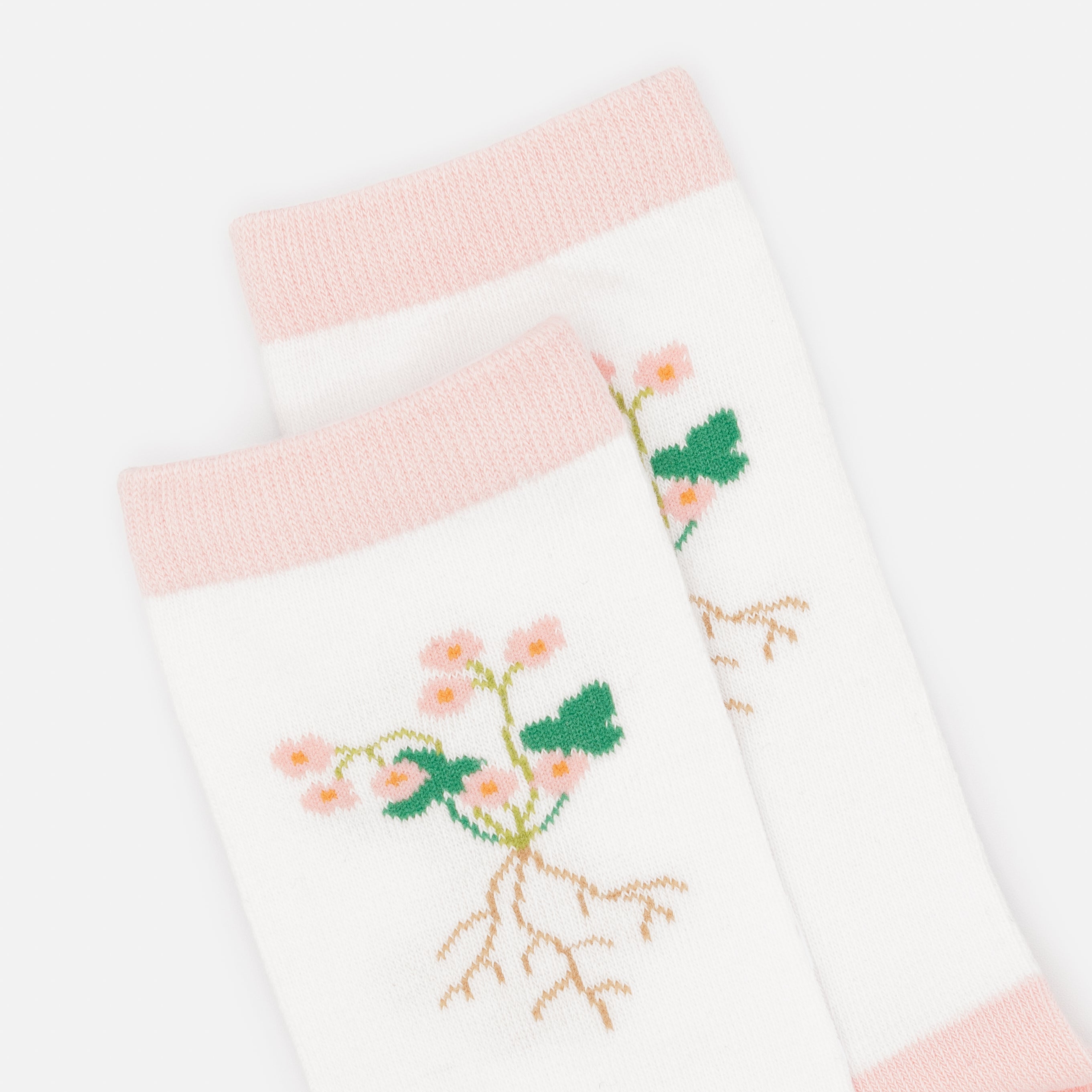 White and pale pink stockings with flower roots
