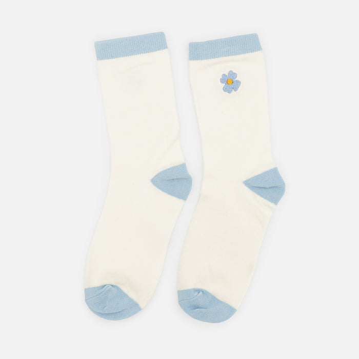 Bas crème avec broderie fleur bleue