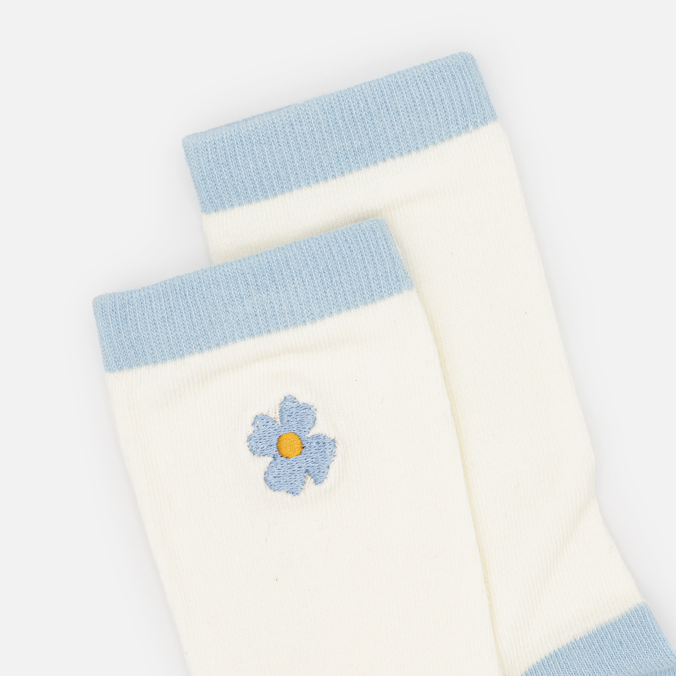 Cream stockings with blue flower embroidery