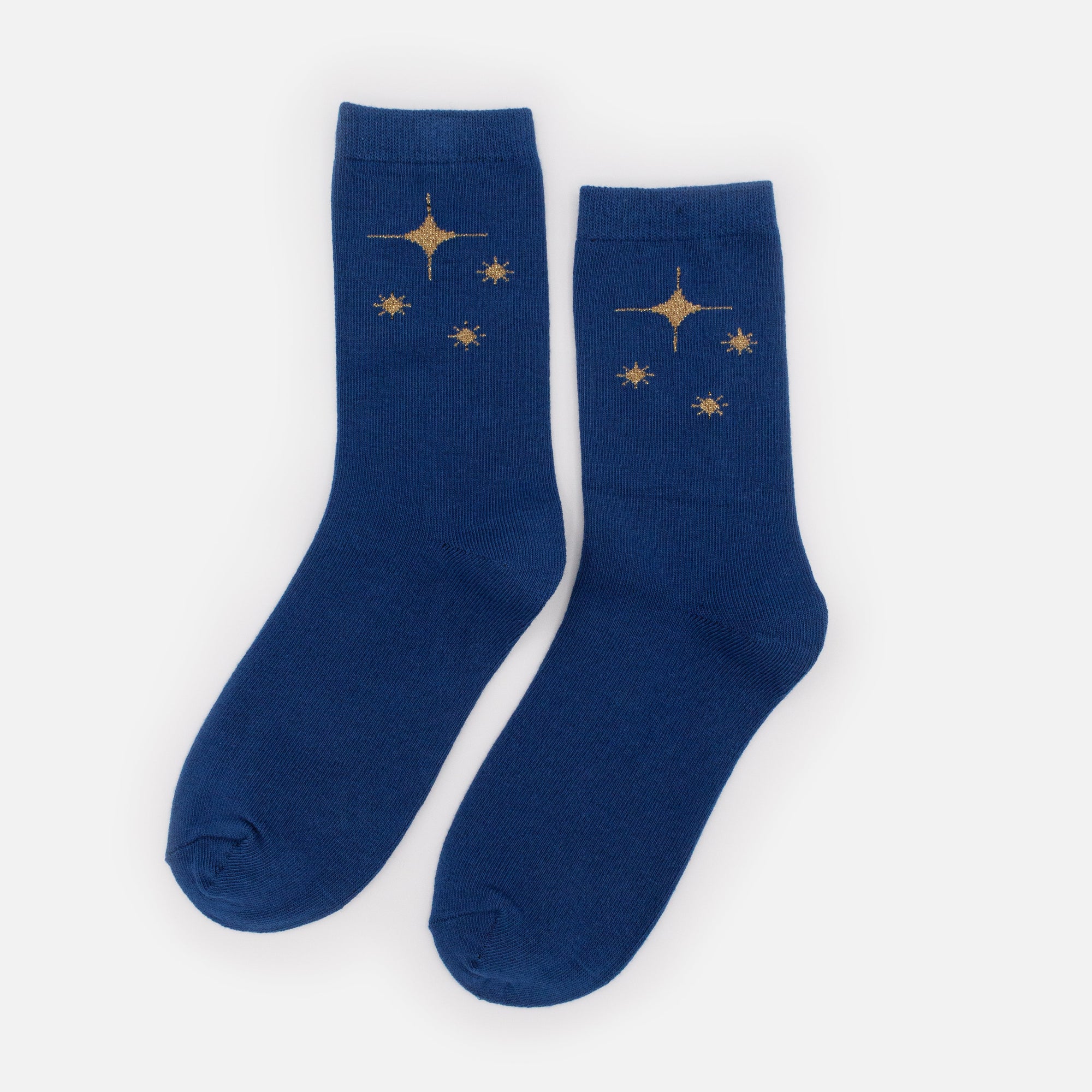 Bas bleu foncé avec étoiles dorées scintillantes